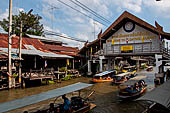 Thailand, Locals sell fruits, food and products at Damnoen Saduak floating market near Bangkok 